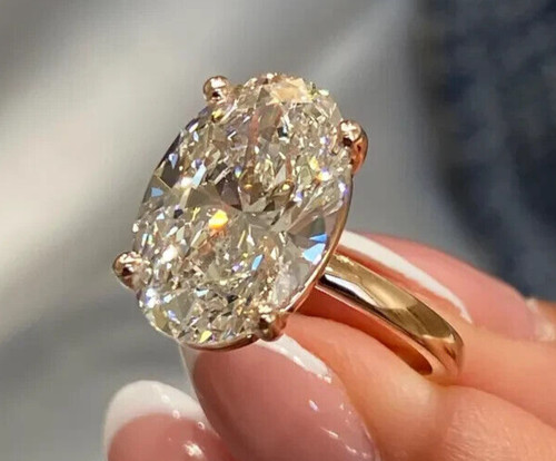 Solid 14k yellow gold - oval, cut